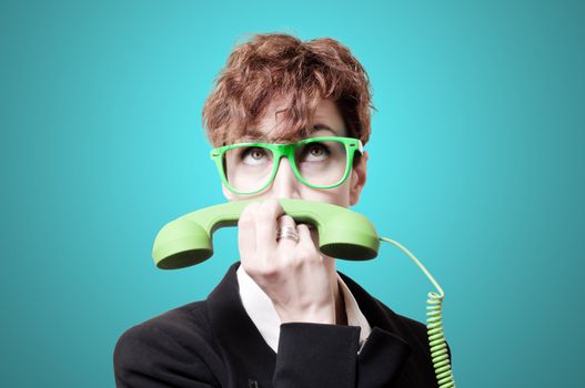 business woman with green phone handset like mustache on blue background