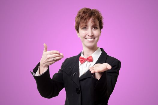 elegant businesswoman with bow tie showing on pink background