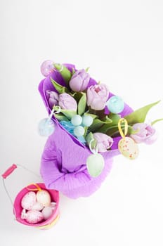 Top view to easter eggs and bouquet