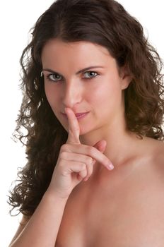 Closeup of a woman with her finger over her mouth