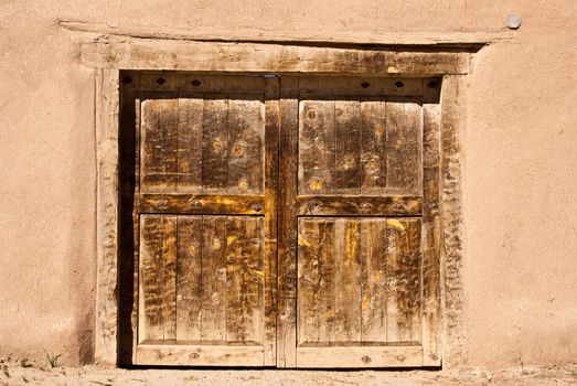 Old door and adobe wall in New Mexico