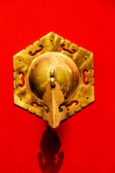 Red Door Ornate Brass Knocker, one of the symbols of China, Houhai Lake, Beijing