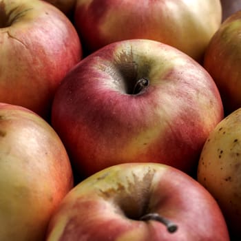 background filled with red apples,shallow depth of field.