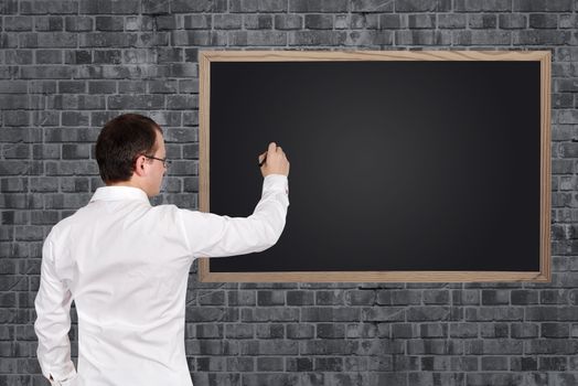 businessman drawing blank on blackboard