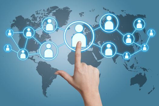 woman hand pressing social media icon on blue background with world map