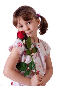 Cute little girl holding a red rose