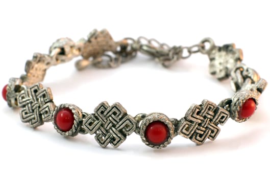 Metal bracelet with corals on white backgriund