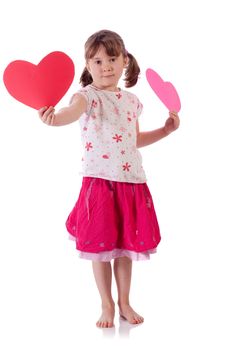 Cute little girl holding two hearts