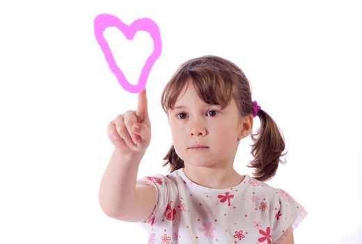 Cute little girl drawing a pink heart with her finger