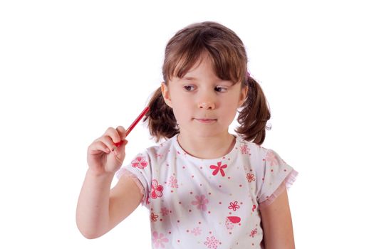 Cute little girl drawing in the air with a pencil