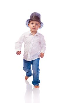 Little boy with a hat walking