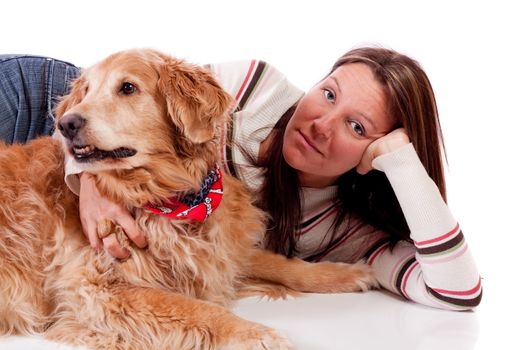 Cute young woman with her purebred Golden Retriever