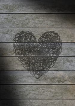 Heart scribbled on a gray weathered wood background
