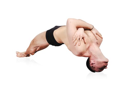 man practicing yoga in position on white background