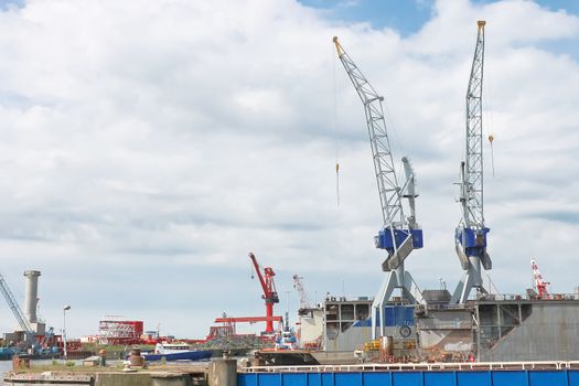 Industrial landscape. Dry docks and cranes in shipyard