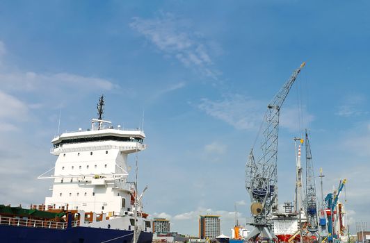 Industrial landscape. Ship and crane in shipyard 