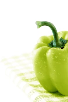Green sweet bell pepper on Green Napkin.