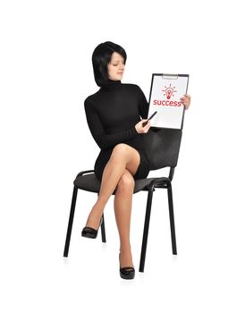 businesswoman sitting on chair with success symbol on clipboard