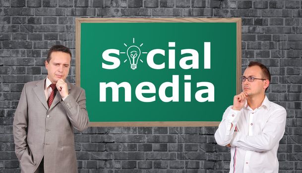 two businessman and social media symbol on board