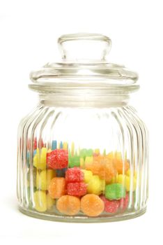 A variety of tasty candies in cliche candy jar.