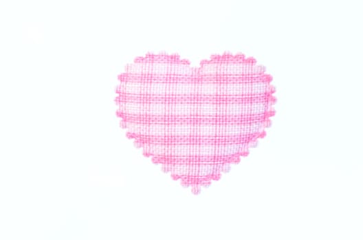 Pink heart isolated on white background.