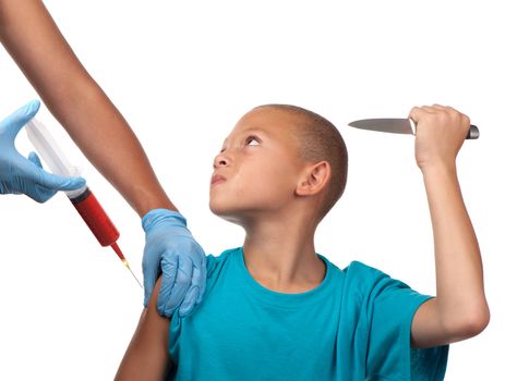 A boy threatens to stab a healthcare worker with a knife should the needle penetrate his skin.