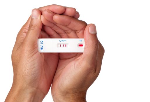 The result of a positive rapid HIV test is held by two female hands.