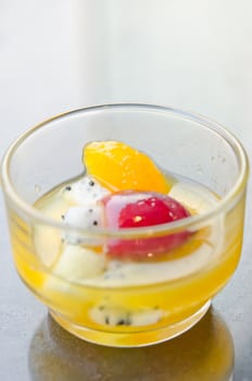 mix fruits in glass  ( grape  orange dragon fruits )  