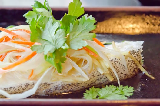 close up steamed white fish fillet with  vegetable