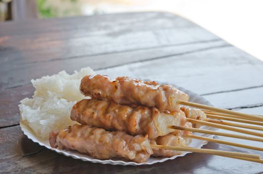 grilled pork with sweet sauce served with sticky rice