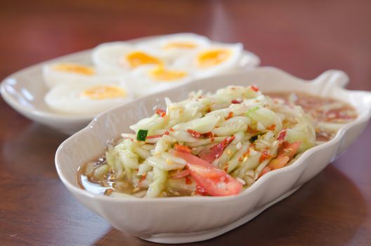 spicy cucumber  salad served with boiled egg