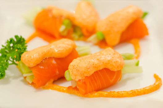 salmon rolls with vegetable on  plate  , seafood dish