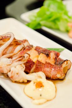 deep fried squid on white plate ,  (ika teriyaki) seafood dish