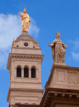 View of Jesus and St. Peter statues on the Basilica of the Sacred Heart of Jesus in Rome