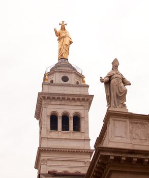 View of Jesus and St. Peter statues on the Basilica of the Sacred Heart of Jesus in Rome
