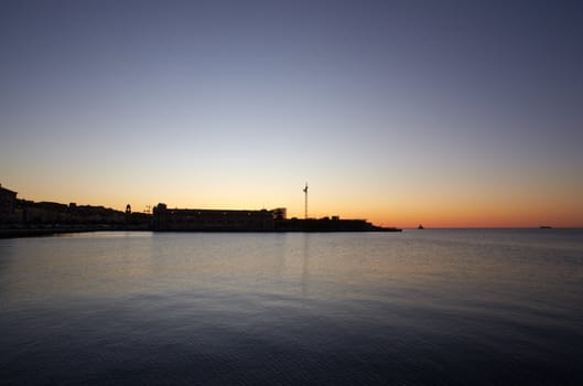 View of Trieste harbor at sunset, Italy