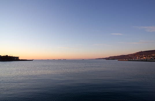 View of Trieste harbor at sunset, Italy