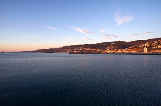View of Trieste harbor at sunset, Italy