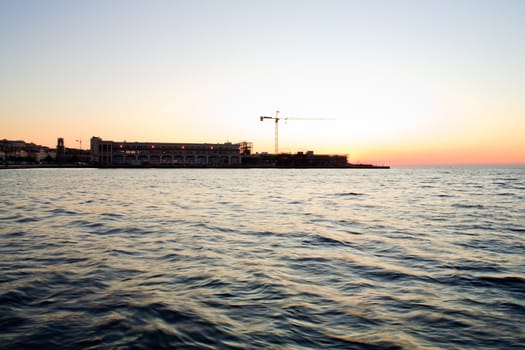 View of Trieste harbor at sunset, Italy