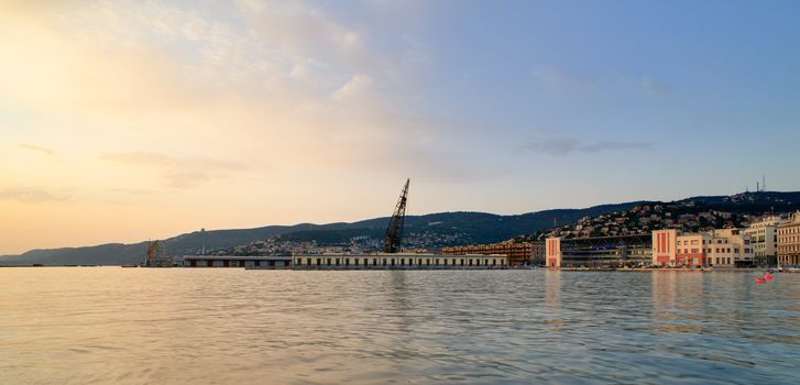 View of Trieste harbor at sunset, Italy