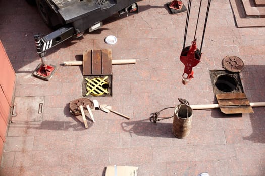 Tools next to the Manhole opened for maintenance