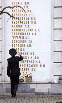 Men in uniform looking the Odessa memorial dedicated to local heroes of the Soviet Union