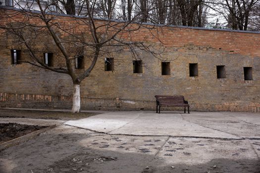 Photo of a Bench next to the wall