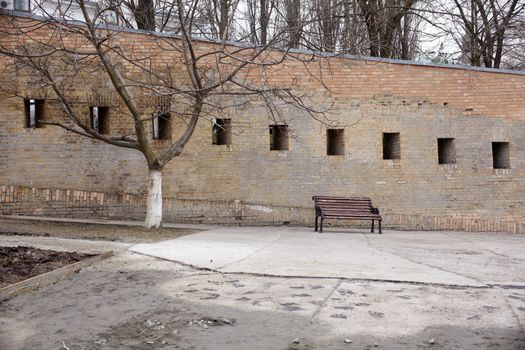Photo of a Bench next to the wall