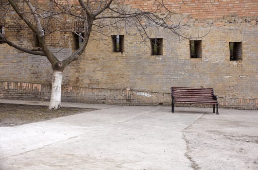 Photo of a Bench next to the wall