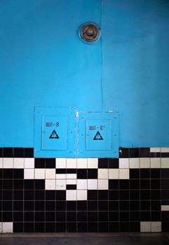 Blue room with black and white tiles