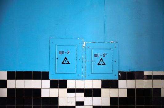 Blue room with black and white tiles