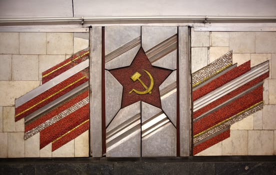 Red star sickle and hammermosaic in the metro of Kiev metro