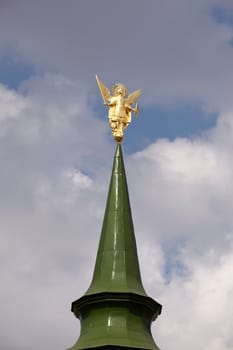 Golden statue on the dome, church in Kiev
