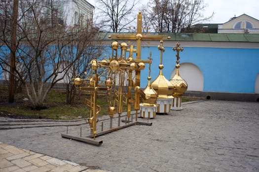 Gold cupolas and orthodox cross, St. Michael monastery in Kiev
